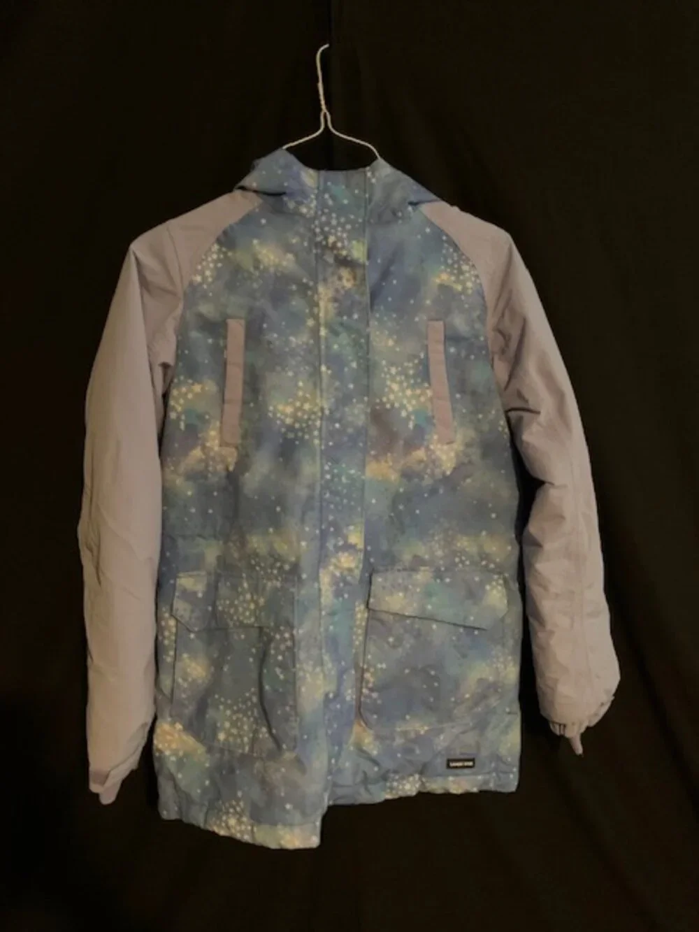 Winter Jacket with Blue‑Teal Pattern & Purple Sleeves – Bold & Cozy